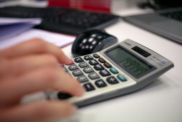 person-using%20calculator person-using%20calculator